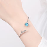 Bracelet en forme de queue de sirene avec perle bleue