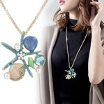 Collier Coquillage <br/> Sautoir perles, paillettes et étoile de mer turquoise