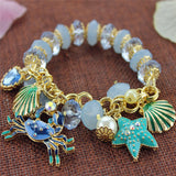 Bracelet Coquillage Perles, crabe, coquilles St-Jaques et étoile de mer